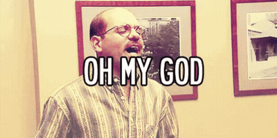 A Bald Man With Glasses Says Oh My God In Front Of Framed Pictures GIF
