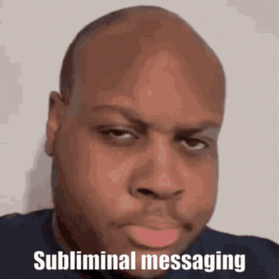A Bald Man With The Words Subliminal Messaging Above His Head GIF