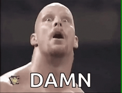 A Bald Wrestler With His Mouth Open And The Word Damn Written Above Him . GIF
