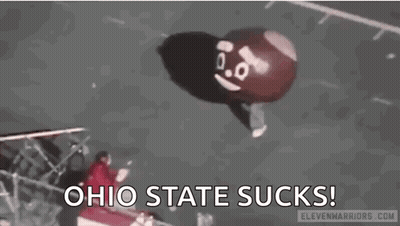 A Balloon With A Face On It Is Flying In The Air And Says `` Ohio State Sucks '' . GIF