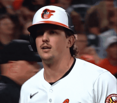 A Baltimore Orioles Baseball Player Wearing A Helmet And A White Jersey GIF