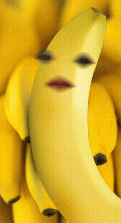 A Banana With A Face On It Surrounded By Other Bananas GIF