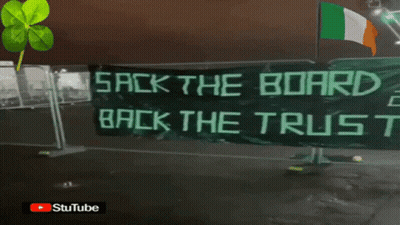 A Banner That Says " Back The Bird " Is Hanging On A Window GIF