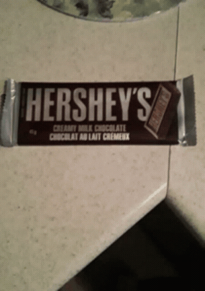 A Bar Of Hershey 'S Creamy Milk Chocolate Is On A Counter GIF