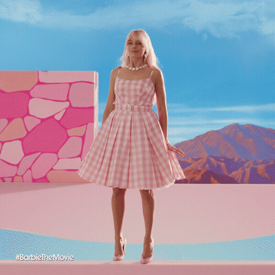 A Barbie Doll In A Pink Dress Is Dancing In A Dollhouse GIF
