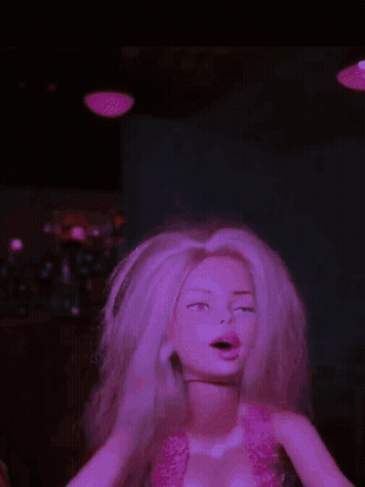 A Barbie Doll With Blonde Hair And A Pink Top GIF