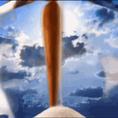 A Baseball Bat Is Flying Through The Air In Front Of A Blue Sky With Clouds . GIF
