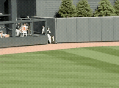 A Baseball Field With A Fence And A Player Wearing A Number 1 Jersey GIF