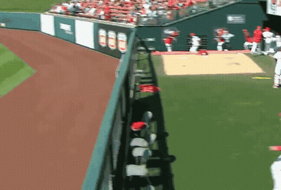 A Baseball Field With A Fence And A Sign That Says ' Angels ' On It GIF