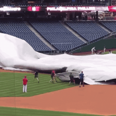 A Baseball Field With A Philadelphia Phillies Sign On The Wall GIF