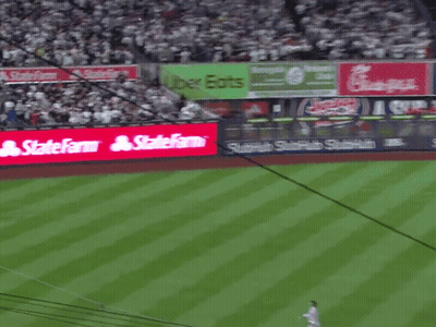 A Baseball Field With A Sign That Says Statefarm On It GIF