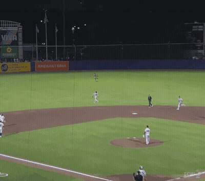 A Baseball Field With An Amerant Bank Sign In The Background GIF