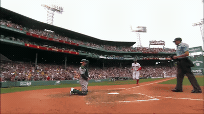 A Baseball Game Is Being Played At A Stadium That Has A Cvs Ad On The Wall GIF
