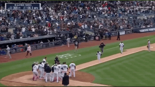 A Baseball Game Is Being Played In A Stadium With A Banner That Says Gleyber Torres GIF