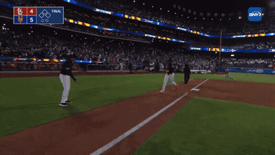 A Baseball Game Is Being Played In A Stadium With A Scoreboard That Says Final GIF
