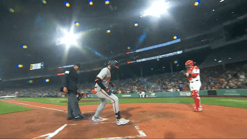 A Baseball Game Is Being Played In A Stadium With A Sign That Says ' Mlb ' On It GIF