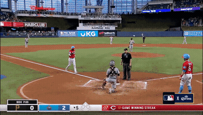 A Baseball Game Is Being Played In A Stadium With Ads For Hairclub And Jkg GIF
