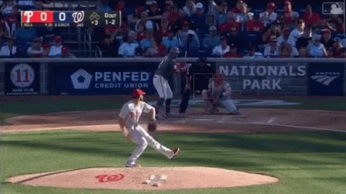 A Baseball Game Is Being Played In A Stadium With Advertisements For Penfed Credit Union And Nationals Park . GIF
