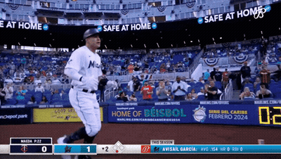 A Baseball Game Is Being Played In A Stadium With Advertisements For Safe At Home And Home Of Beisbol GIF