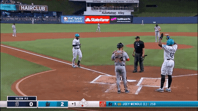 A Baseball Game Is Being Played In A Stadium With An Ad For Hairclub GIF