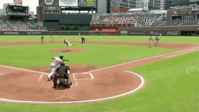 A Baseball Game Is Being Played In A Stadium With Coca Cola And Napa Advertisements On The Stands . GIF