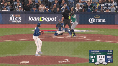 A Baseball Game Is Being Played In Front Of A Banner For Loandepot GIF