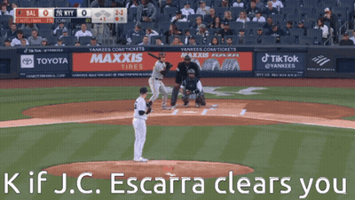 A Baseball Game Is Being Played In Front Of A Banner For Maxxis GIF