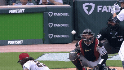 A Baseball Game Is Being Played In Front Of A Banner That Says Fanduel GIF