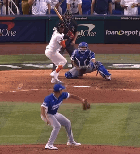 A Baseball Game Is Being Played In Front Of A Banner That Says Loandepot GIF