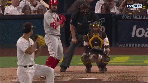 A Baseball Game Is Being Played In Front Of A Banner That Says Padres Beisb GIF