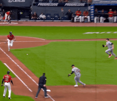 A Baseball Game Is Being Played In Front Of A Banner That Says Progressive GIF