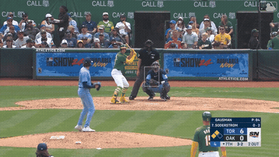A Baseball Game Is Being Played In Front Of A Banner That Says The Show Available Now GIF