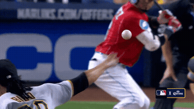 A Baseball Game Is Being Played In Front Of A Corona Banner GIF