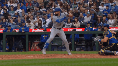 A Baseball Game Is Being Played In Front Of A Crowd With A Fred Meyer Sign In The Outfield GIF