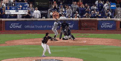 A Baseball Game Is Being Played In Front Of A Crowd With Ford Advertisements GIF