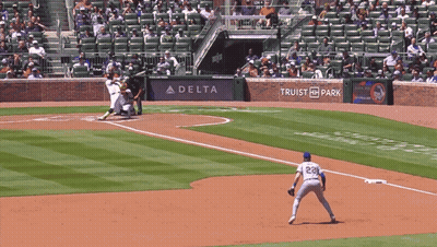 A Baseball Game Is Being Played In Front Of A Delta Ad GIF