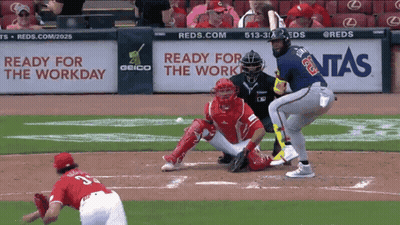 A Baseball Game Is Being Played In Front Of A Geico Sign GIF