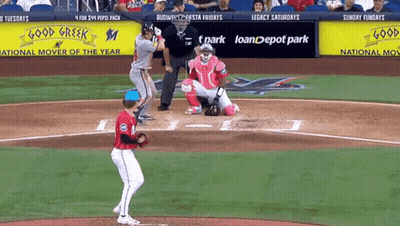 A Baseball Game Is Being Played In Front Of A Good Creek Sign GIF