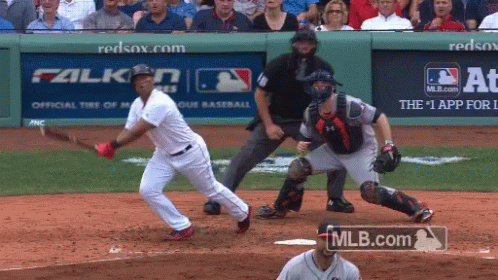 A Baseball Game Is Being Played In Front Of A Mlb.com Advertisement GIF