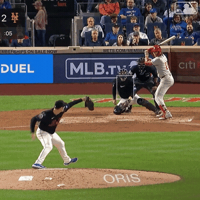 A Baseball Game Is Being Played In Front Of A Mlb.tv Ad GIF