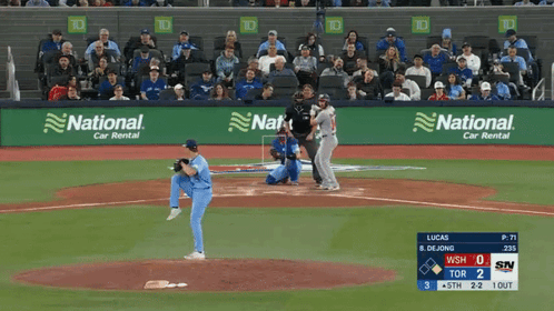 A Baseball Game Is Being Played In Front Of A National Car Rental Advertisement GIF