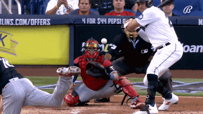 A Baseball Game Is Being Played In Front Of A Pepsi Sign GIF