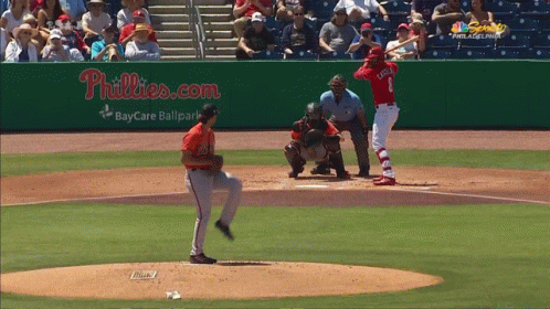 A Baseball Game Is Being Played In Front Of A Phillies.com Sign GIF