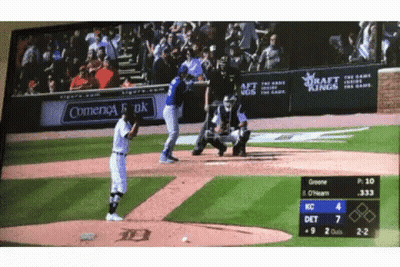 A Baseball Game Is Being Played In Front Of A Sign That Says Comienca Bank GIF