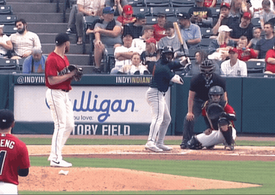A Baseball Game Is Being Played In Front Of A Sign That Says Indy Indians GIF