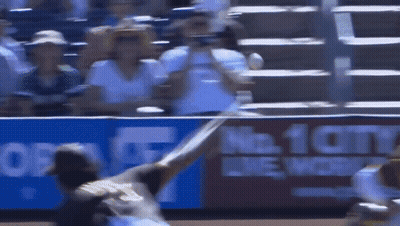 A Baseball Game Is Being Played In Front Of A Sign That Says No 10 GIF