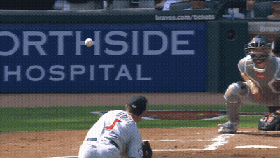 A Baseball Game Is Being Played In Front Of A Sign That Says Orthside Hospital GIF