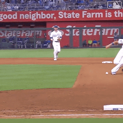 A Baseball Game Is Being Played In Front Of A State Farm Banner GIF