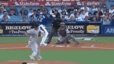 A Baseball Game Is Being Played In Front Of A State Farm Sign GIF
