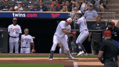A Baseball Game Is Being Played In Front Of A Twins Advertisement GIF